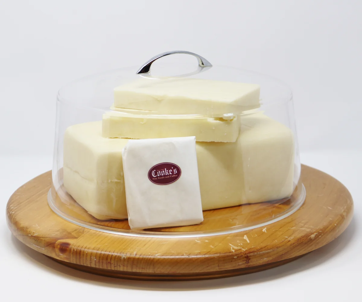 Hartley's signature Canadian cheddar presented under a glass dome
