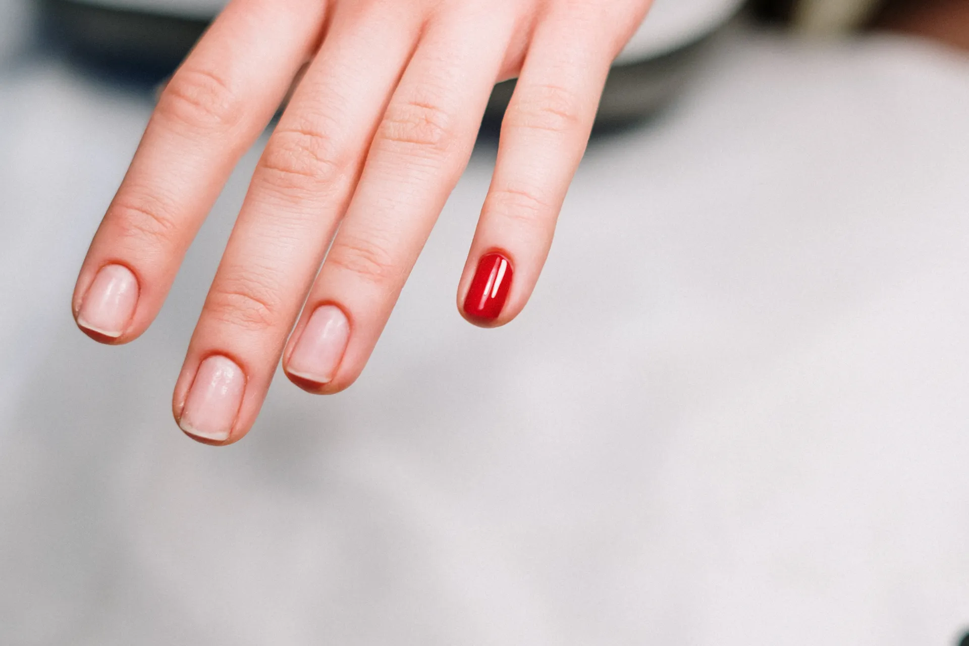 Nail technician at work on a detailed set